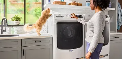 woman-standing-next-to-washer